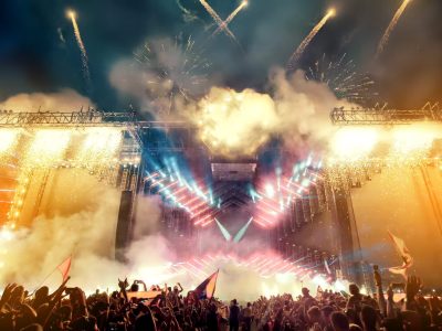 Crowd at concert and blurred stage lights with fireworks Crowd at concert and blurred stage lights with fireworks